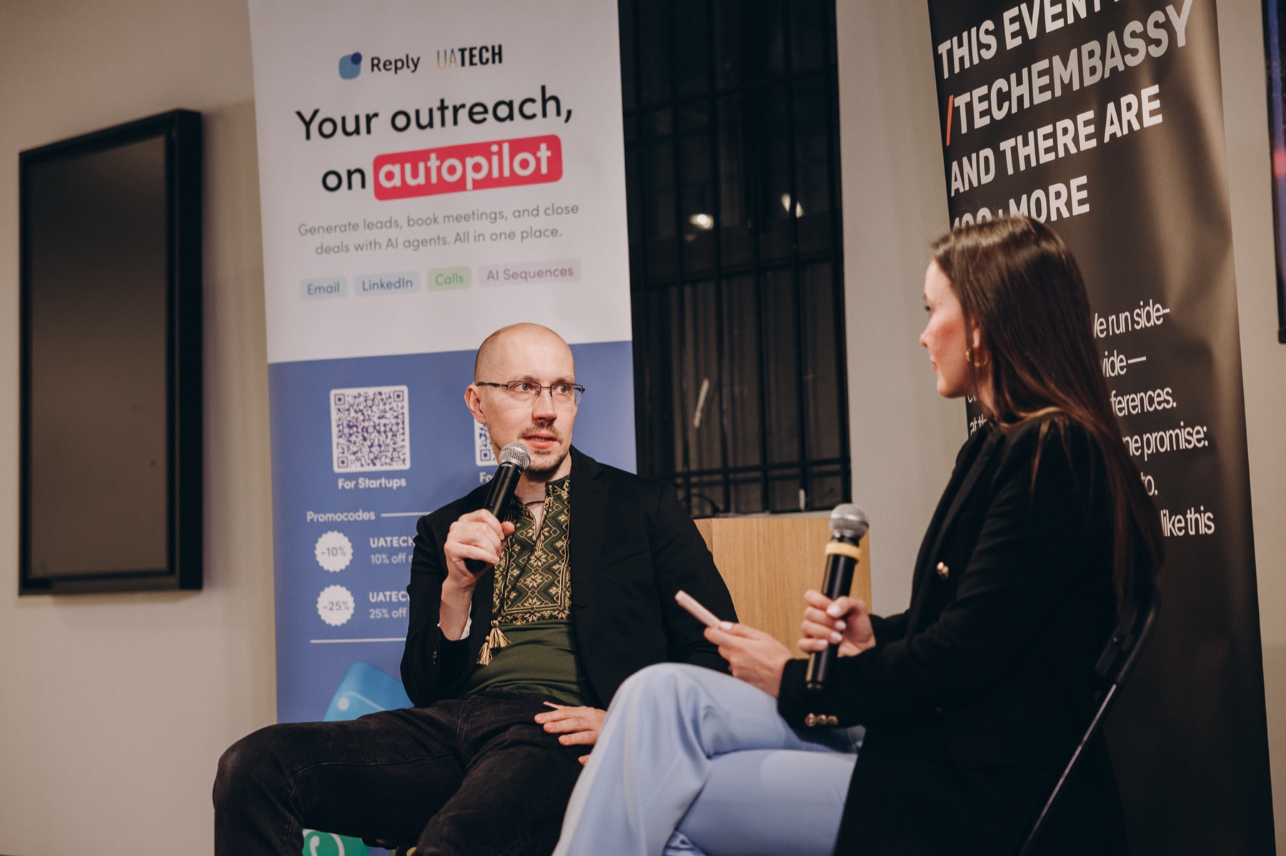 Two speakers in conversation during a TechEmbassy panel discussion.